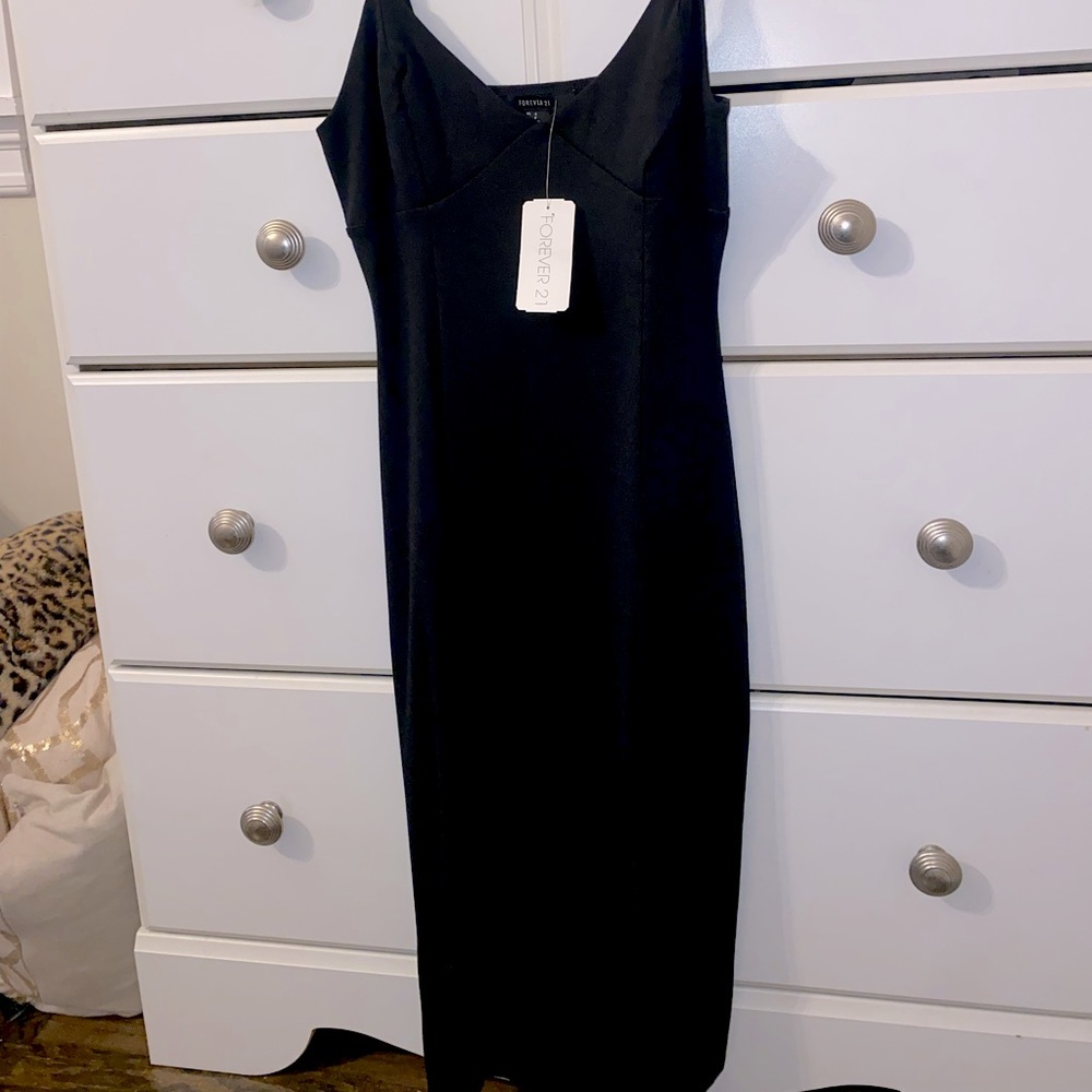 BRAND NEW. Black midi dress with slit.